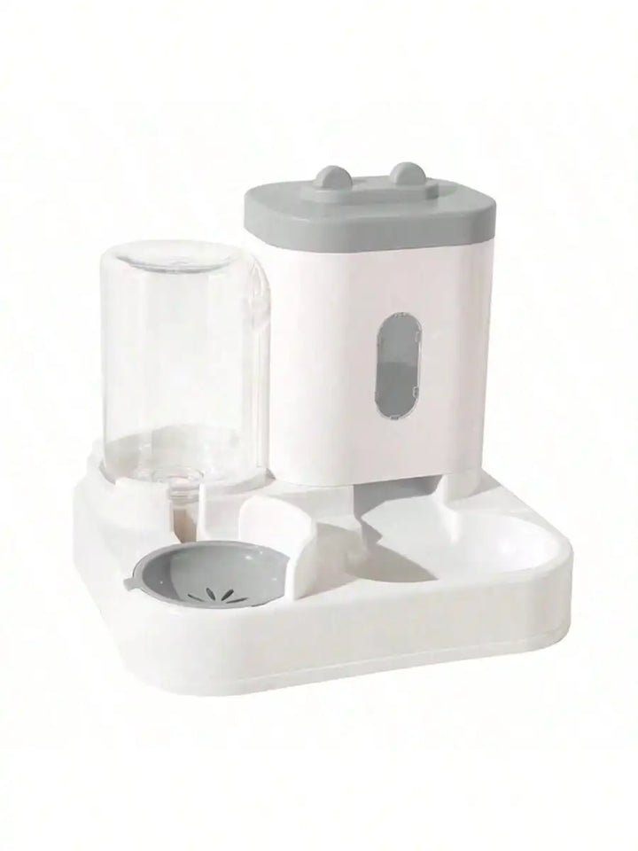 Distributeur d'eau automatique pour animaux, blanc et gris, en plastique, avec réservoir transparent.