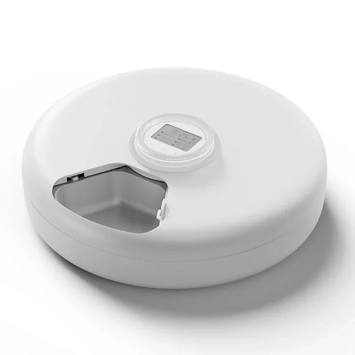 Boîte ronde blanche en plastique avec affichage numérique et compartiment de rangement intégré.