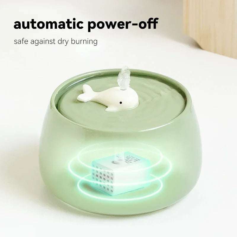 Humidificateur automatique en verre vert avec décor en forme de baleine, système de sécurité anti-séchage.
