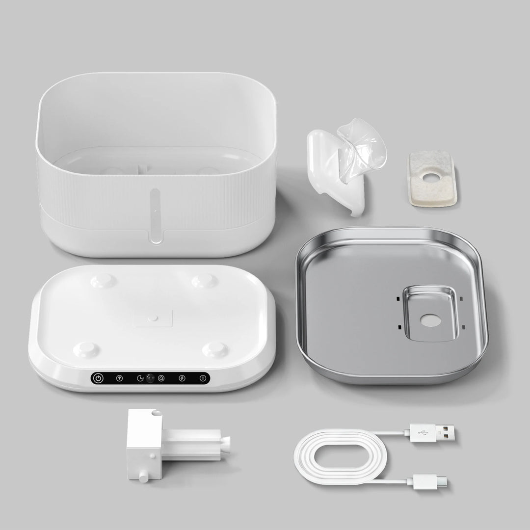 Diffuseur d'huile essentiel blanc, composé de plastique et métal, avec accessoires et chargeur USB inclus.